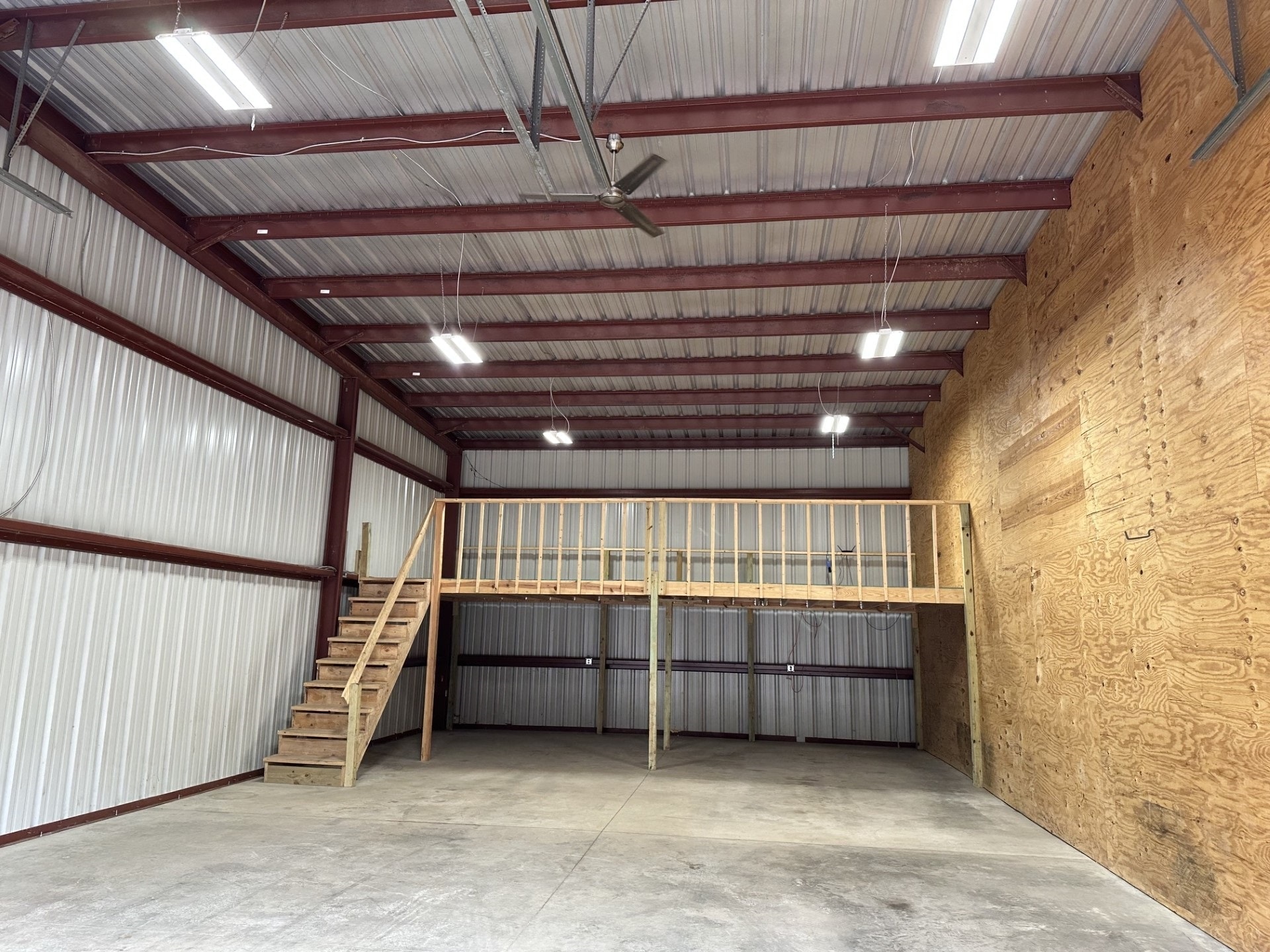 Large storage unit interior with overhead door open